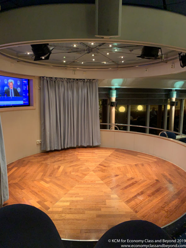a room with a television and a wood floor