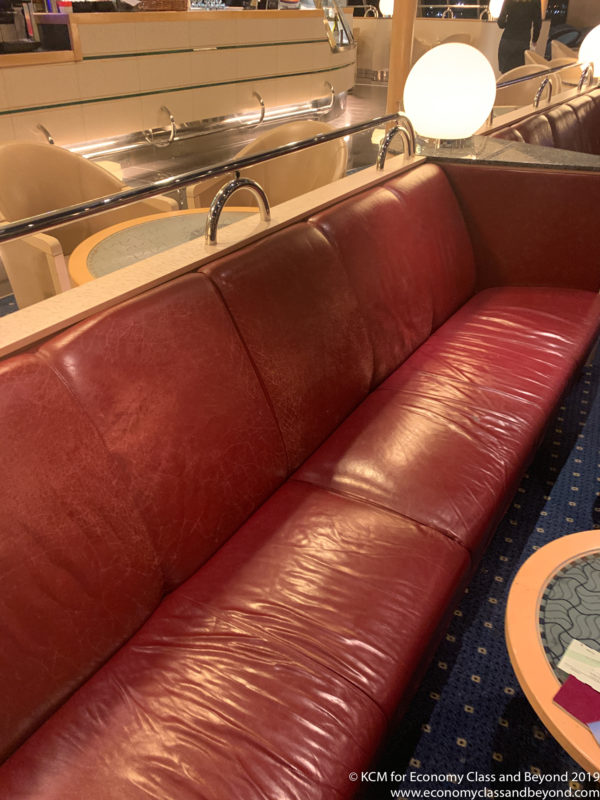 a red leather couch in a restaurant