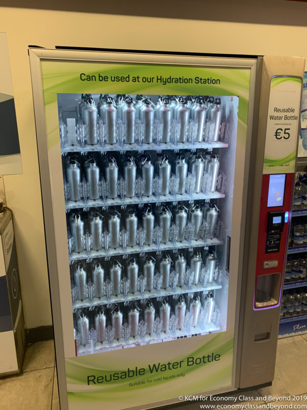 a vending machine with water bottles