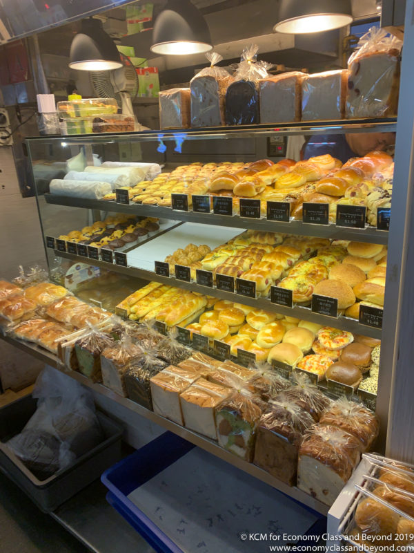 a display case of bread and pastries