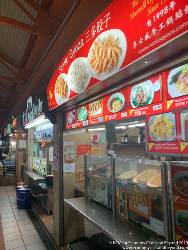 a food stand with signs and images