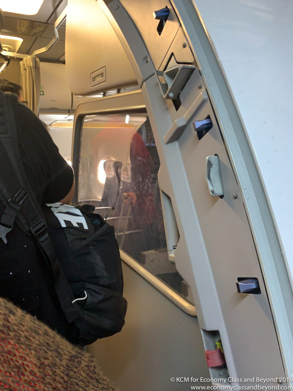 a person with a backpack on a plane