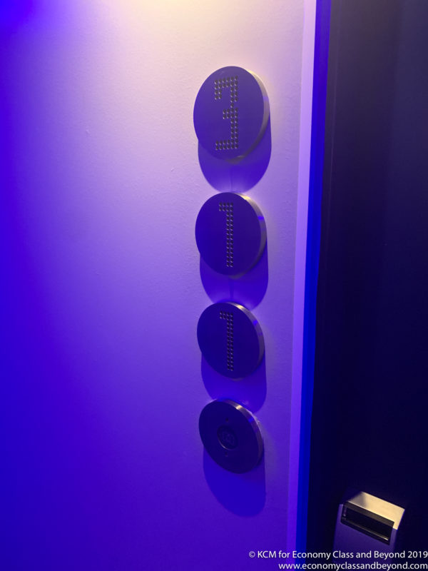 a group of circular buttons with numbers on a wall