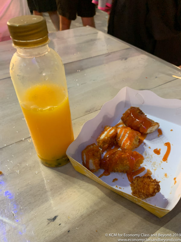 a bottle of orange juice next to food