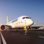 a white airplane on a runway