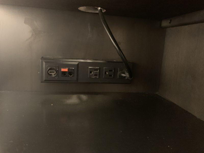 a black outlet with cords and plugs