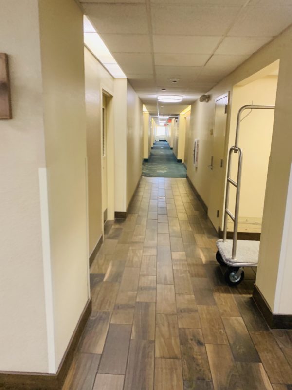 a long hallway with a cart