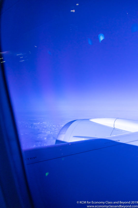 a view of the wing of an airplane from a window
