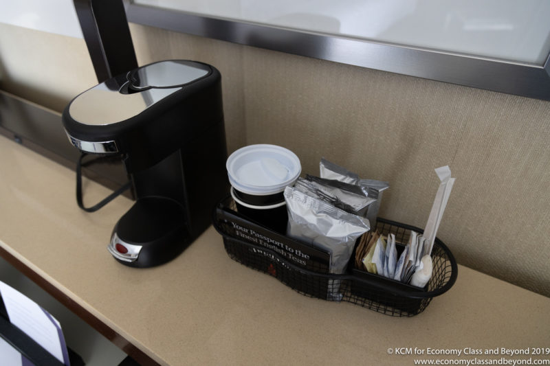 a coffee machine and coffee cup on a counter