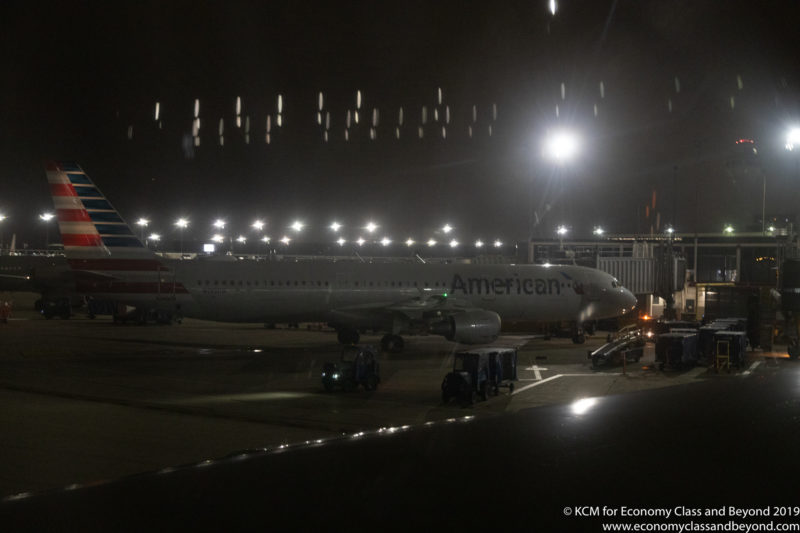 an airplane at an airport at night