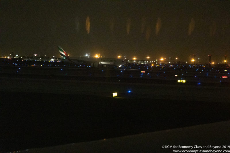 an airplane on a runway at night
