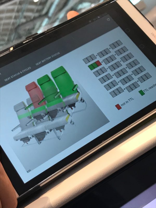 a tablet with a diagram of seats