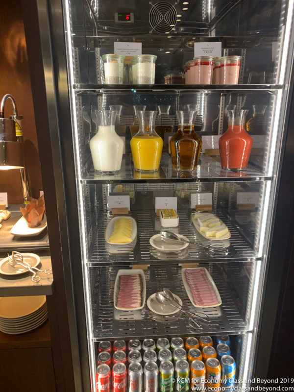 a glass case with different types of food on it