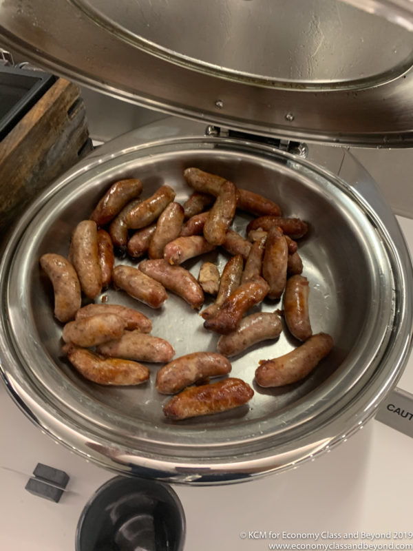 a bowl of sausages in a stove