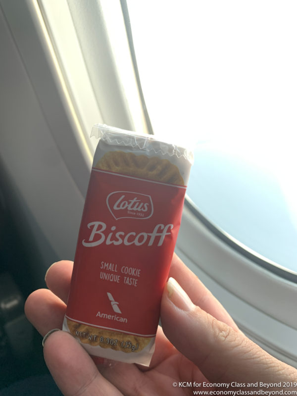 a hand holding a package of biscoff