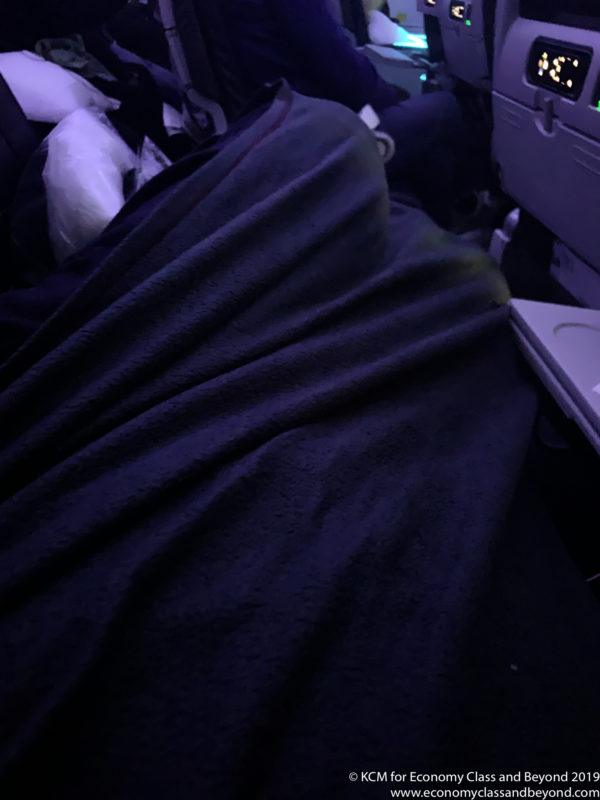 a person sleeping in a blanket