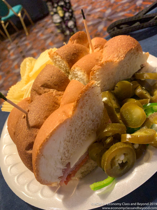 a plate of food with a sandwich and chips