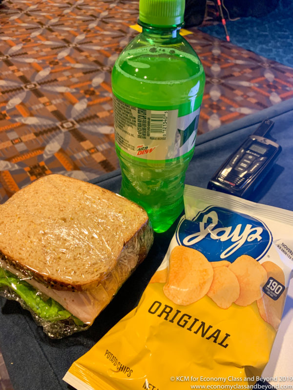 a sandwich and a drink on a table