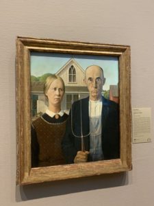 a painting of a man and woman in a frame