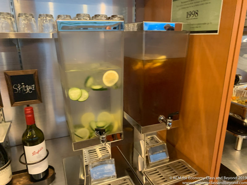 a water dispenser with lemons and cucumbers