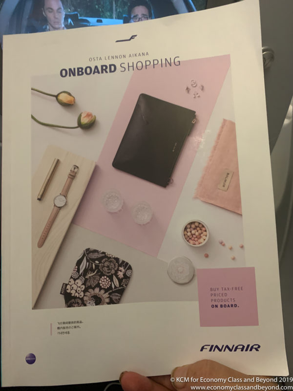 a magazine with a picture of a purse and other items