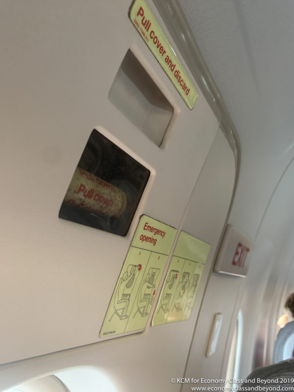 a close up of a sign on a plane