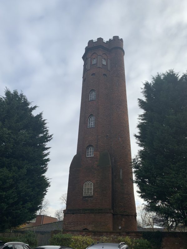 a tall brick tower with windows