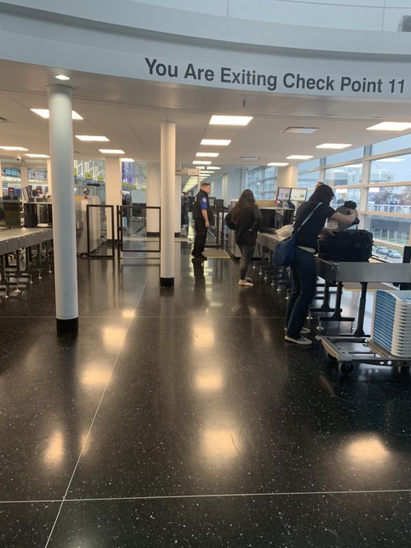 people standing in a check-in area