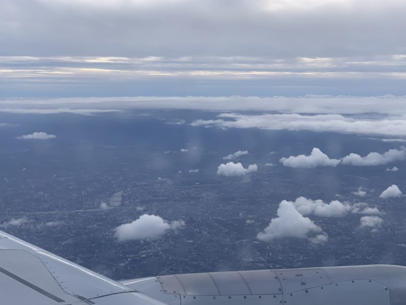 an aerial view of a city and clouds