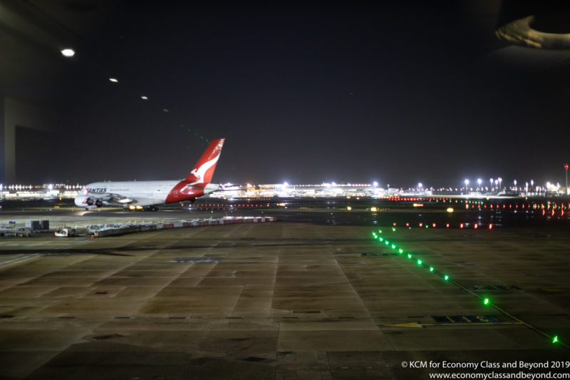 an airplane on the runway at night