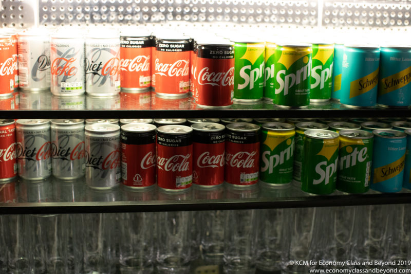 a shelf of cans and glasses