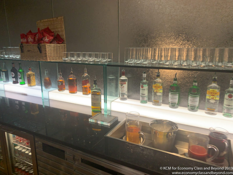 a bar with bottles of liquor and glasses