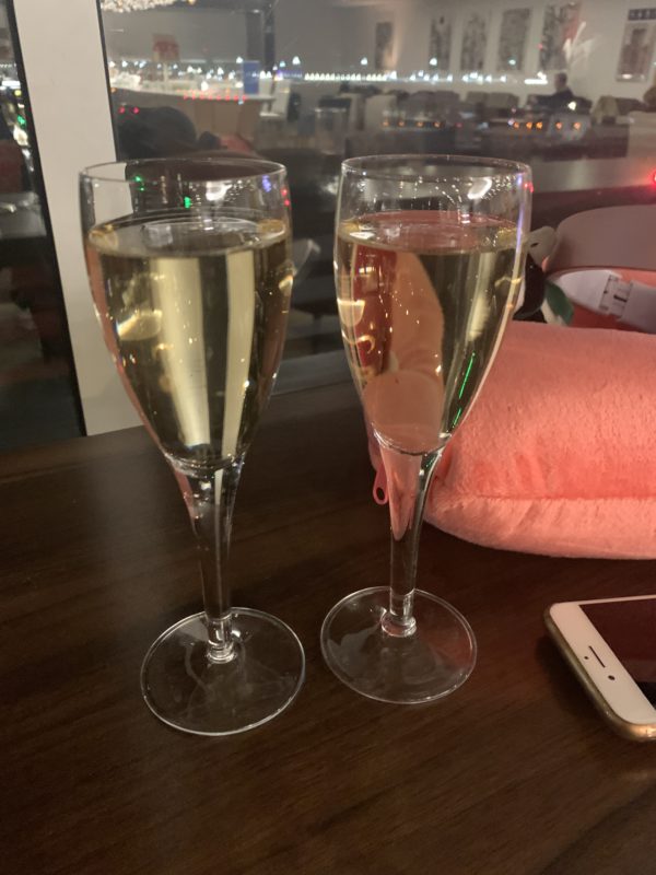 two glasses of champagne on a table