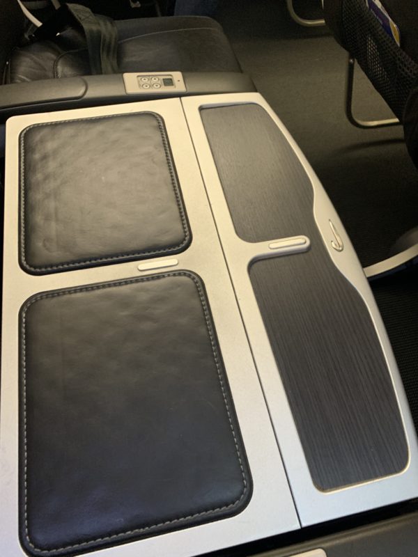 a seat with a black and grey seat pad