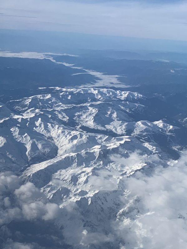 a aerial view of a snowy mountain range