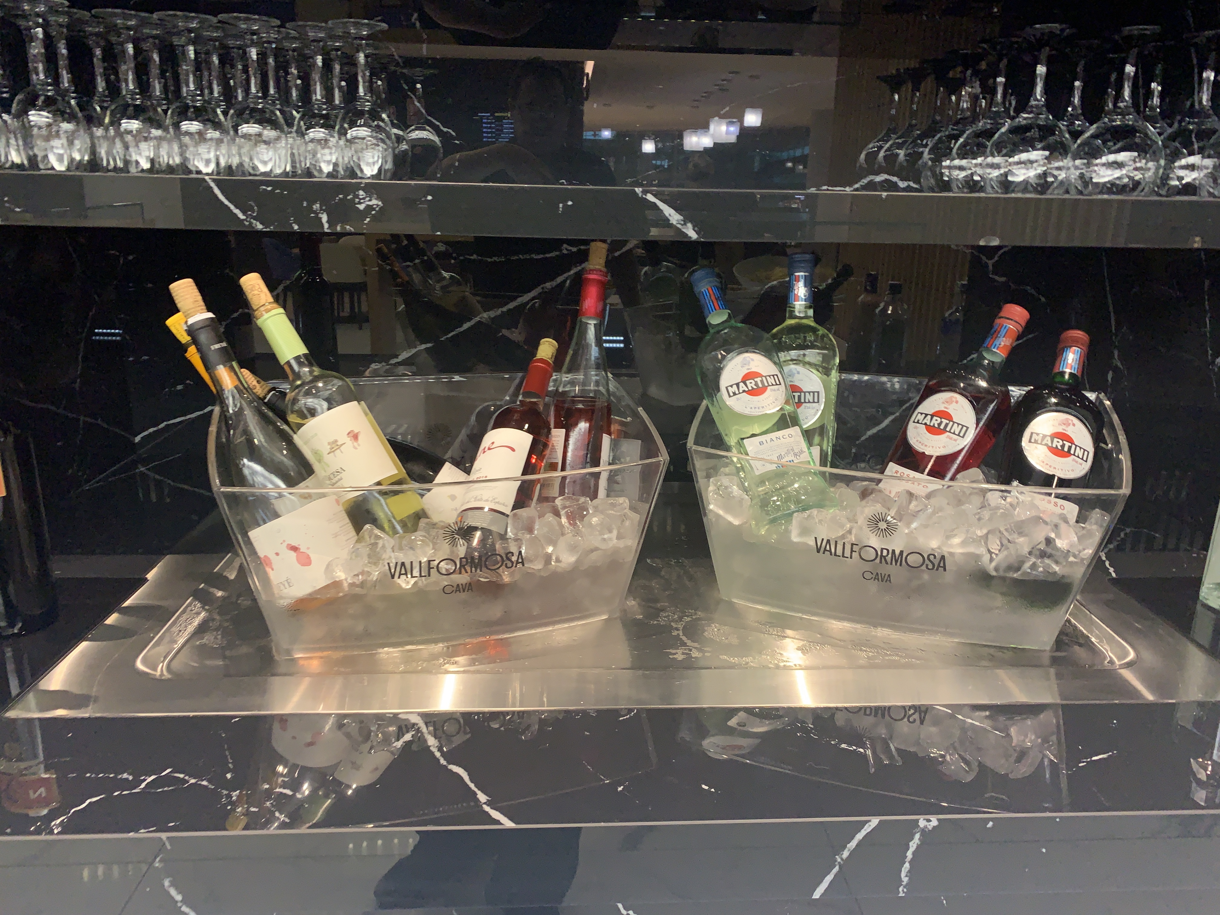 bottles of wine in ice on a counter