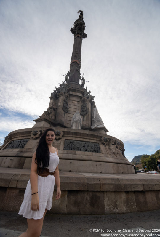 a woman standing in front of a monument