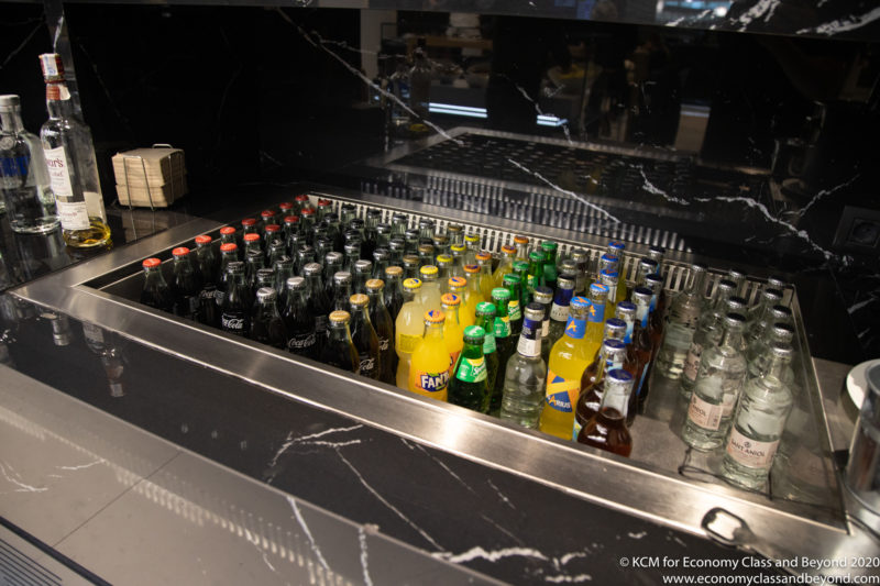 a group of bottles in a cooler