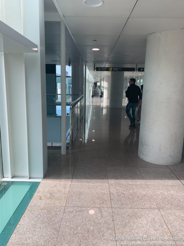 a man walking in a hallway
