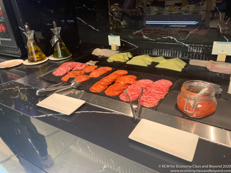 a buffet with different types of meats and cheese