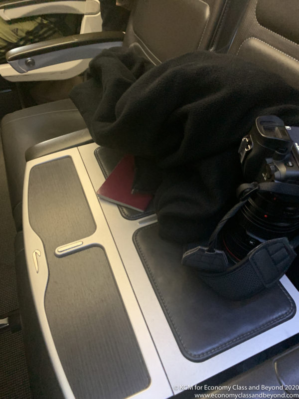 a camera and a passport on a seat