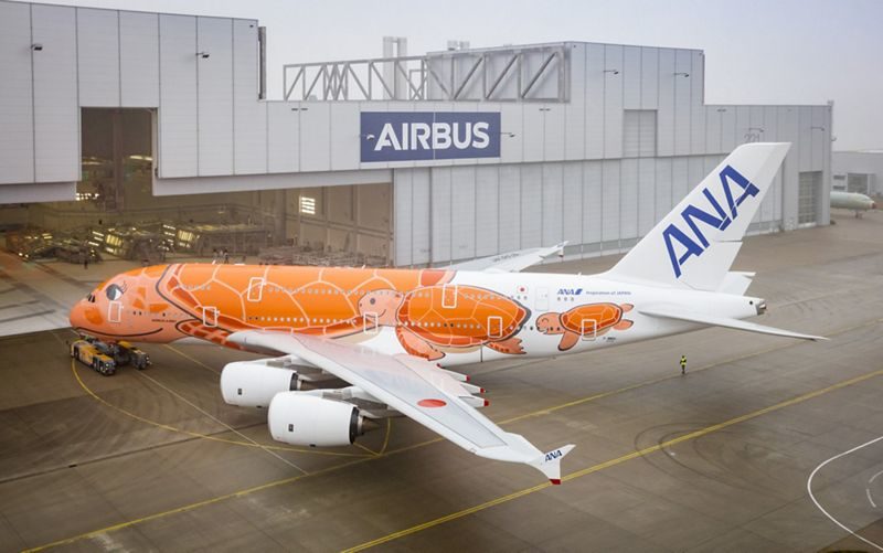 an airplane with an orange design on it