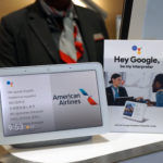 a tablet and a sign on a table