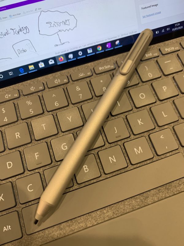 a pen on a keyboard
