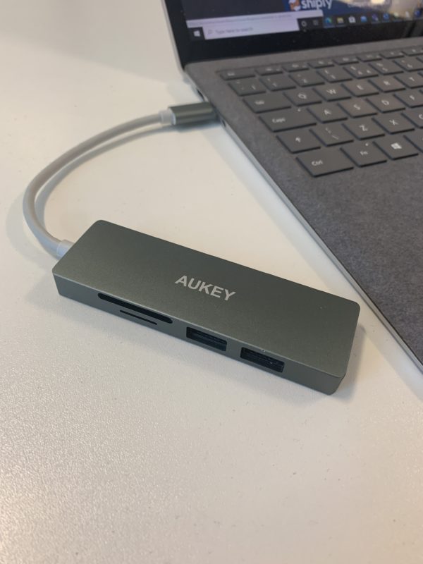 a grey usb port next to a laptop