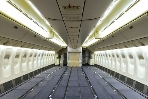 an empty airplane with lights