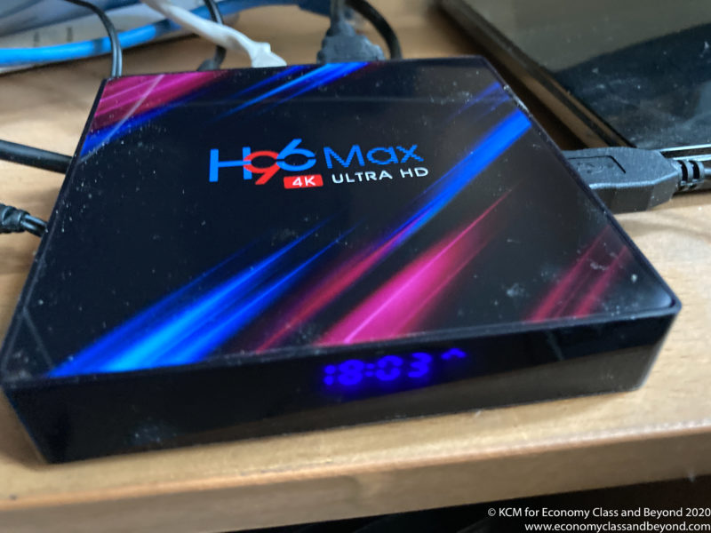 a black box with a blue and pink logo