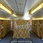 boxes wrapped in ropes on a plane