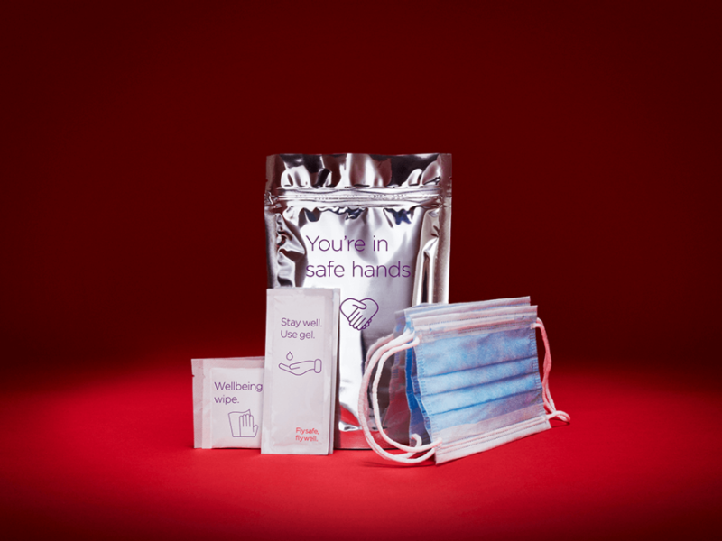 a group of medical face masks and a pack of wipes
