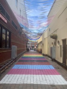 a colorful walkway with a colorful string of string over it